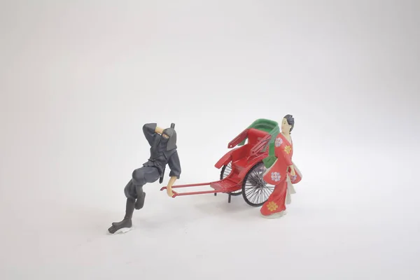 Uma Mini figura e vermelho vintage oriental rickshaw táxi — Fotografia de Stock