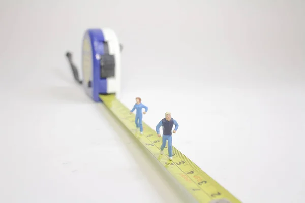 The Tape of measure with running figure — Stock Photo, Image