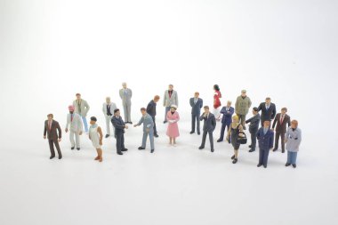 Mini iş kavramı: iş adamları el sallamak