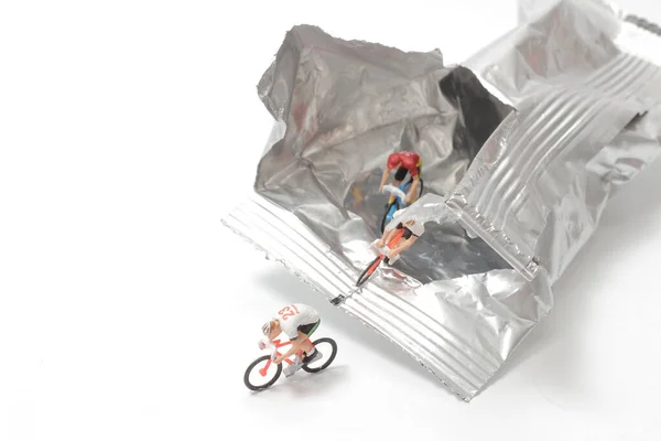 Mini bike figure ride from the Foil Package Bag — стоковое фото