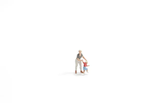 A zabawa postać nosić jej dziecko w biały baord — Zdjęcie stockowe