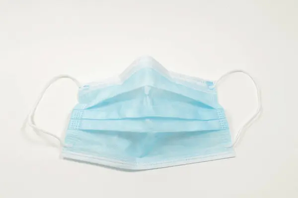 a Flu mask,  Surgical Ear-Loop Mask on White
