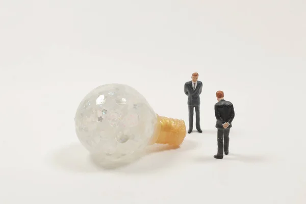 Business creative idea, help building light bulb on white