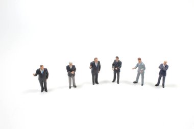 İş adamı minaiture figürü ayakta ve toplantı