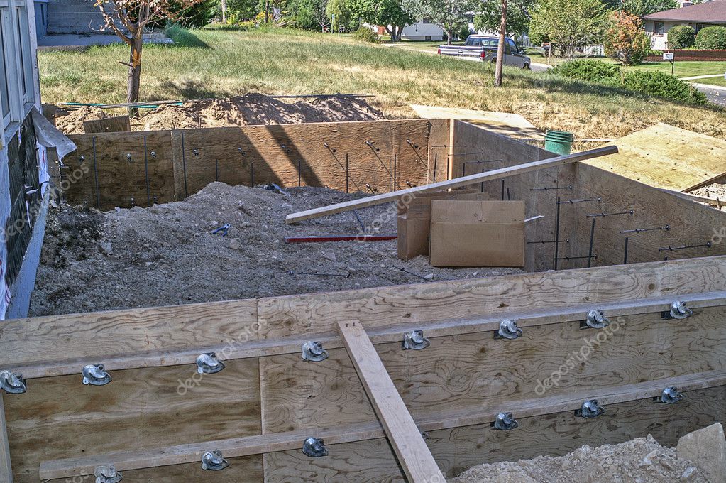 Outside Plywood Forms Built for Footings on Home Addition ⬇ Stock Photo