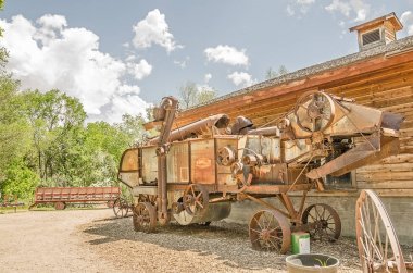 Rusty threshing machine looks unwieldy and very difficult to use clipart