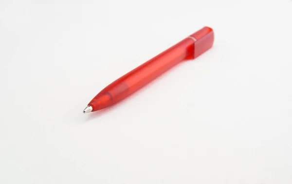 Plastic red ballpoint pen on white background — Stock Photo, Image