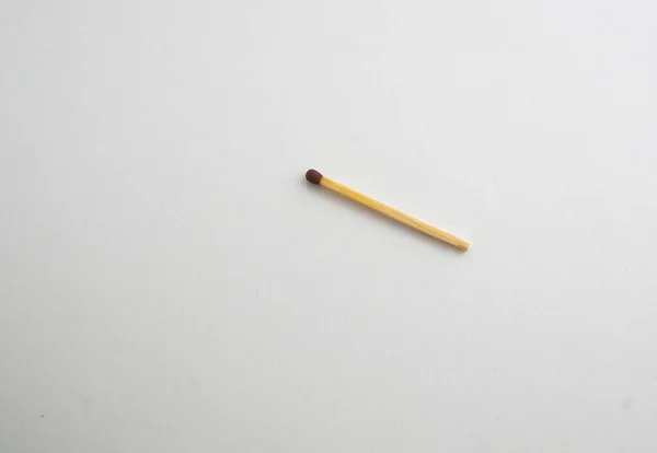 wooden match on a white background