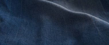 Aşınmış ve buruşmuş mavi kot pantolon arka planı