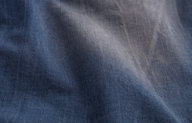 Aşınmış ve buruşmuş mavi kot pantolon arka planı