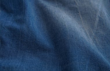 Aşınmış ve buruşmuş mavi kot pantolon arka planı