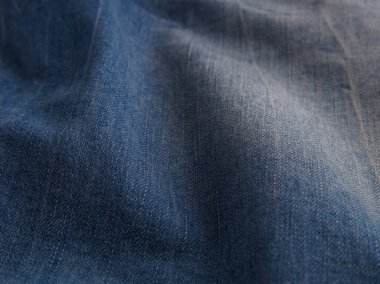 Aşınmış ve buruşmuş mavi kot pantolon arka planı