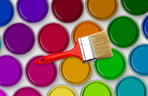 Paint brush on paint tins — Stockfoto