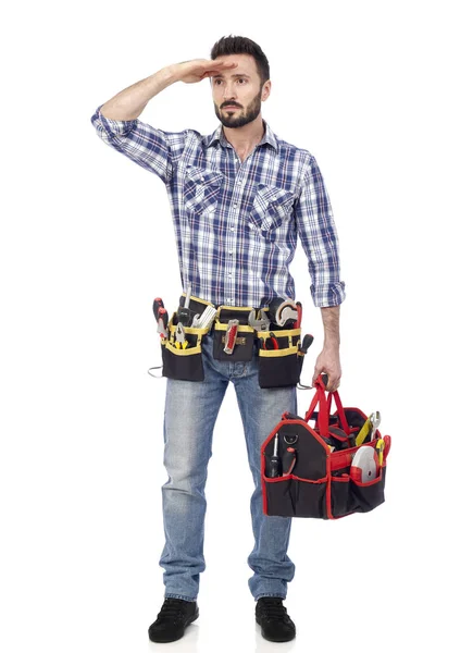 Handyman tittar i fjärran — Stockfoto