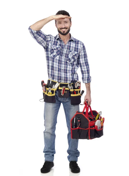 Handyman med verktygslådan titta i fjärran — Stockfoto