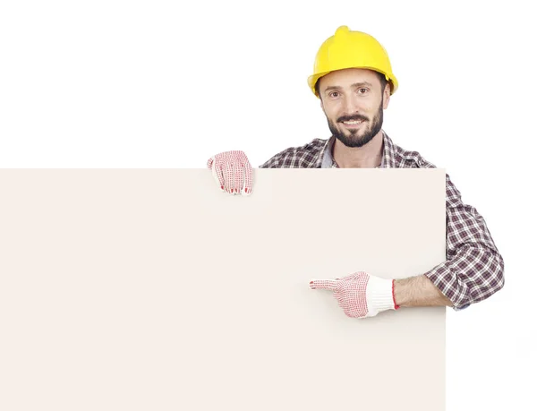 Handyman apontando para placa em branco — Fotografia de Stock
