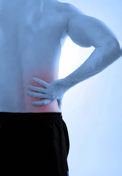 Rückenschmerzen auf blauem Hintergrund — Stockfoto