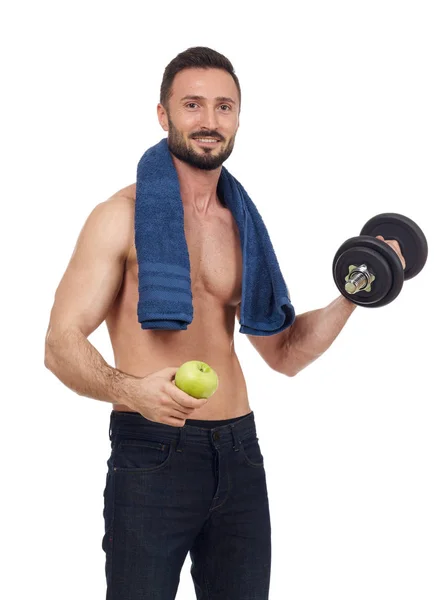 Homem alegre sem camisa com maçã e haltere — Fotografia de Stock