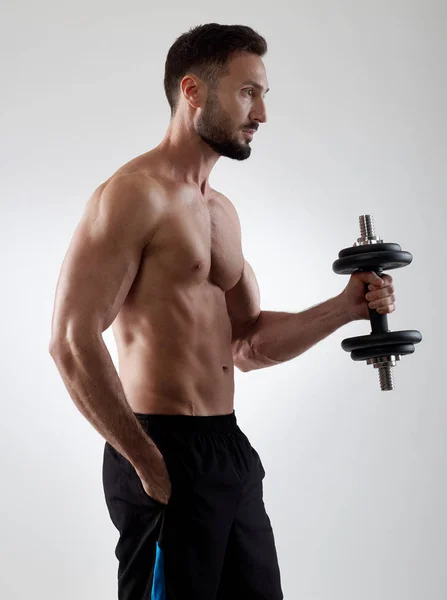 Sportsman with dumbbell — Stock Photo, Image