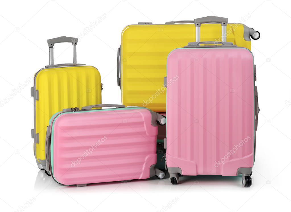 Travel suitcases on white
