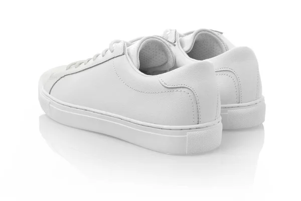 Білі кросівки на білому — стокове фото