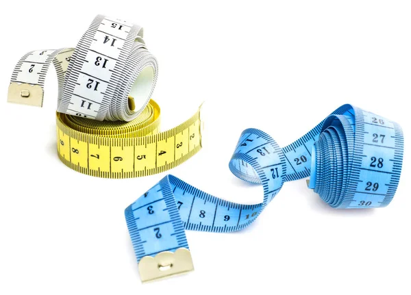 Fitas de medição em fundo branco — Fotografia de Stock