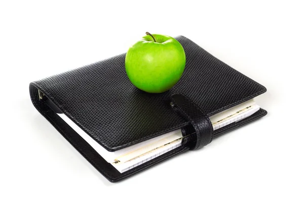 Πράσινο μήλο και σημειωματάριο — Φωτογραφία Αρχείου