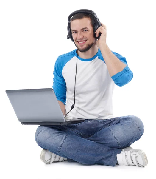 Estudante com laptop e fones de ouvido — Fotografia de Stock