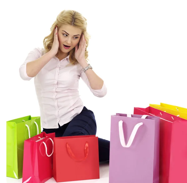 Chica rodeada de bolsas de regalo — Foto de Stock