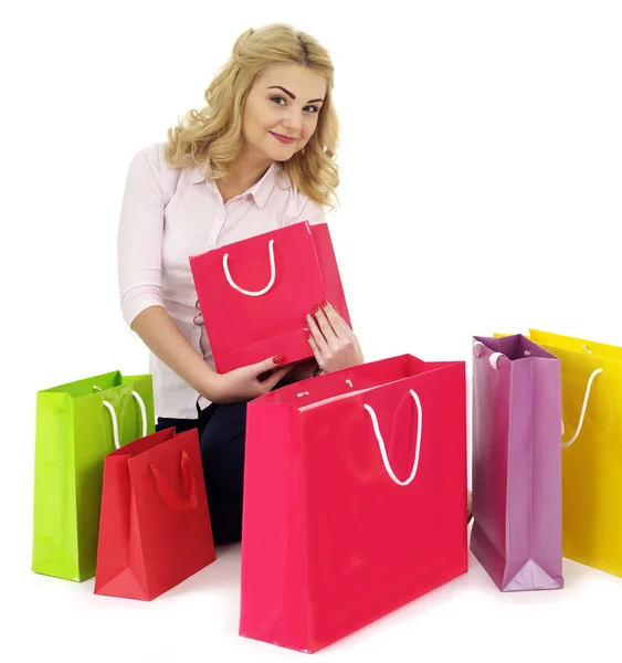 Chica rodeada de bolsas de regalo — Foto de Stock