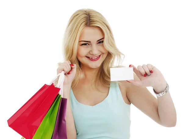 Happy girl with shopping bags and business card — Stock Photo, Image