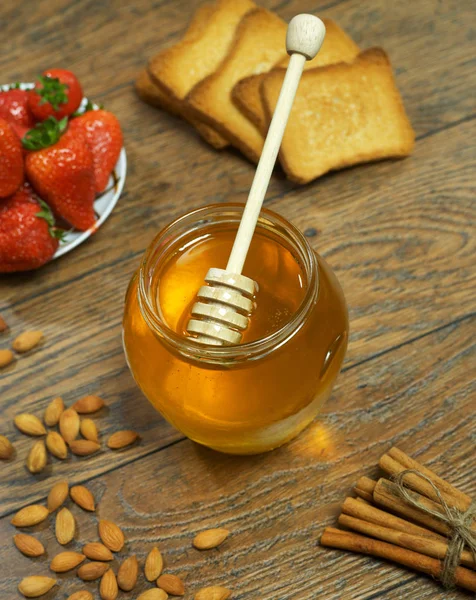 Honey, cookies and strawberries