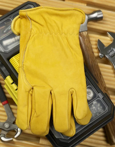 Protection gloves on toolbox — Stock Photo, Image