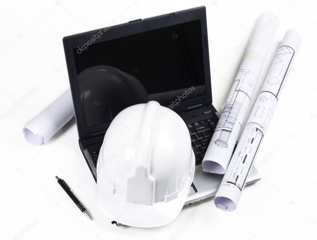 Hardhat, blueprints and laptop