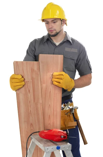 Imprenditore edile con piastrelle in legno duro — Foto Stock