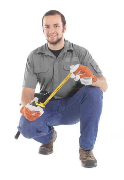 Handyman with tape measure — Stock Photo, Image