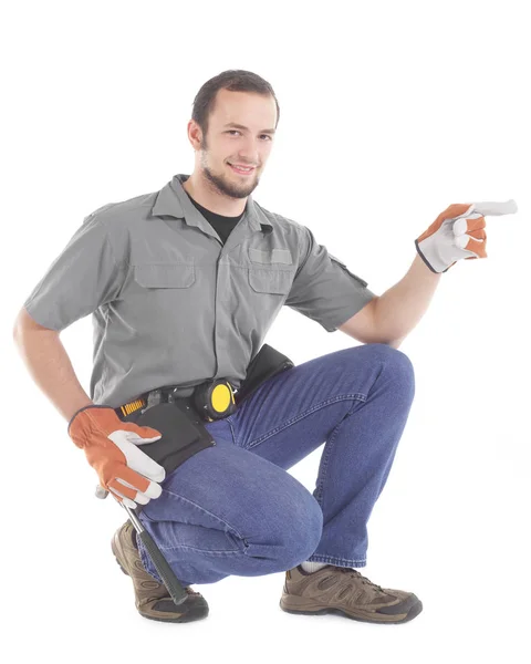 Carpenter pointing on white — Stock Photo, Image