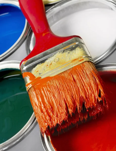 Paint brush and paint cans — Stock Photo, Image