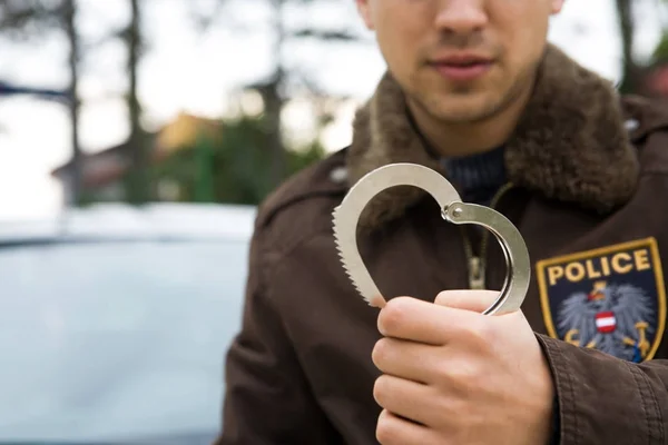 Cop with handcuffs — Stock Photo, Image