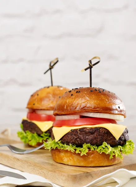 Beef cheeseburgers with copy space — Stock Photo, Image