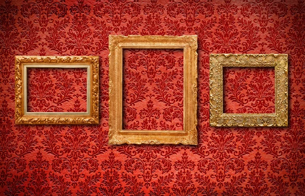 Antique frames on wallpaper