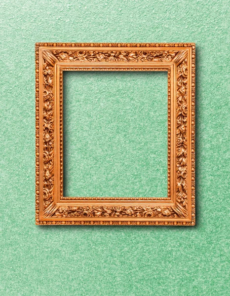 Golden frame on wall — Stock Photo, Image