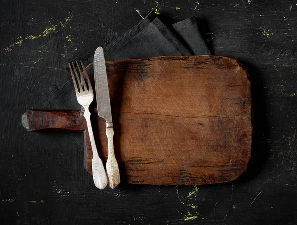 Fork, knife and cutting board — Stock Photo, Image