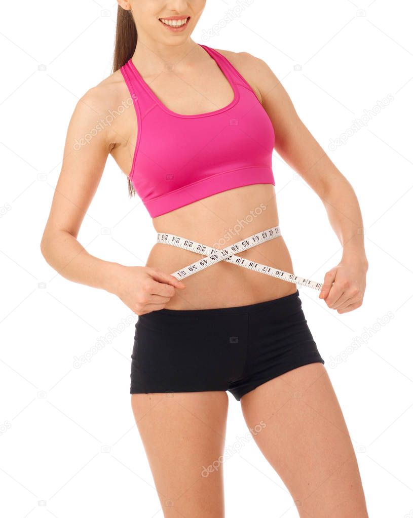 Slim woman with tape measure around her waist