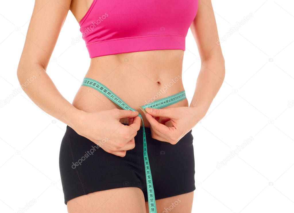 Slim woman with tape measure around her waist