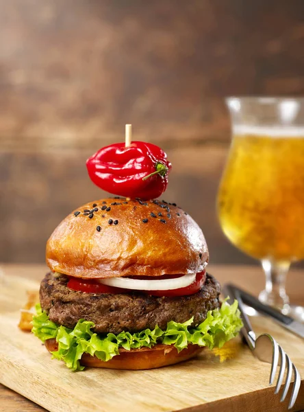 Burger and beer on wood