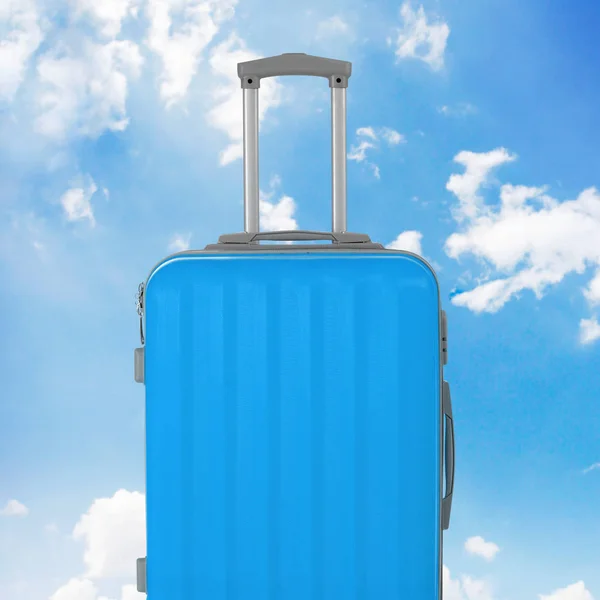 Blue luggage with sky background — 스톡 사진