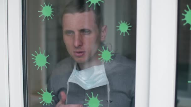 Mann niest hinterm Fenster — Stockvideo