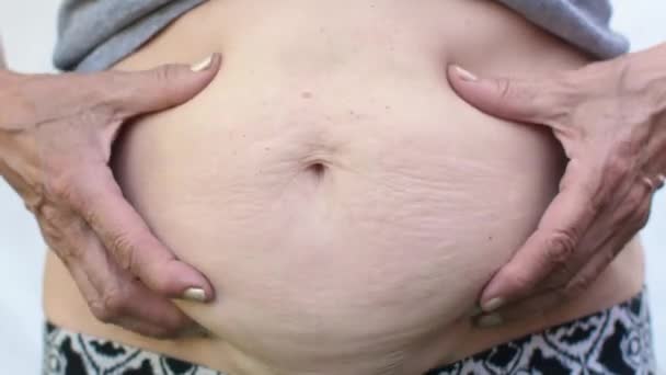 Woman measuring her belly fat — Stock Video