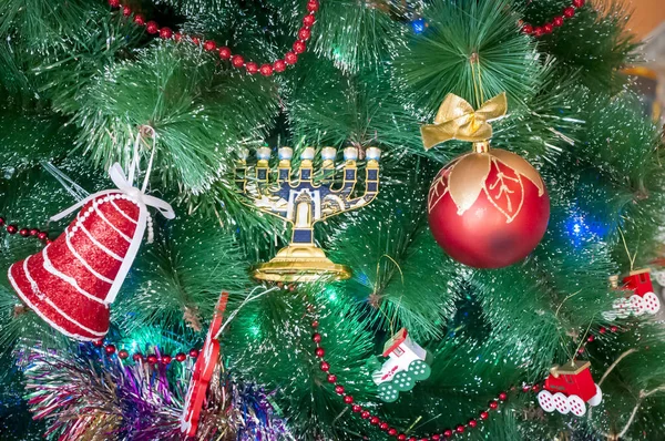 Jewish menorah on a Christmas (New Year) tree. — Stock Photo, Image